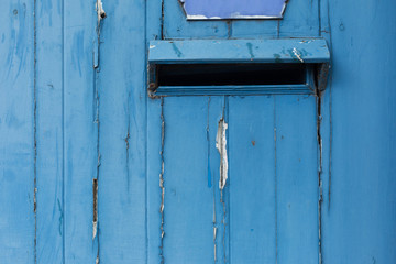 Embeded Mailbox in Blue Wooden Wall
