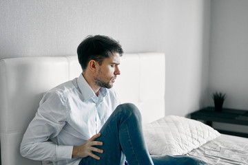 Obraz premium man sitting on sofa at home