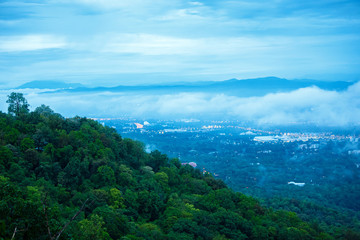Fototapeta na wymiar Scenery on top view of Chiang Mai City on landscape Doi Suthep moutain in twilight sky with misty cloud