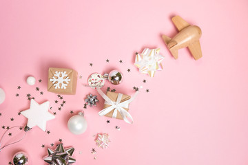 wooden children's plane on a classic pink background