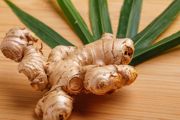 Ginger with green leaf  over white background 