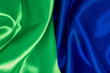 Background green and blue satin fabric in pleats