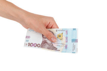 Thousand hryvnias by one banknote in the hand, isolated