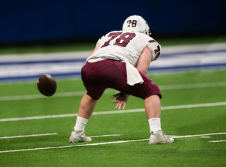 Great action photos of football players making amazing plays during a football game