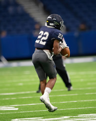Great action photos of football players making amazing plays during a football game