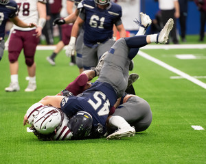 Great action photos of football players making amazing plays during a football game © Joe