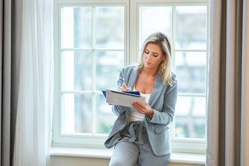 Businesswoman resting in hotel room