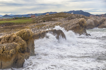Waves and a tiny human figure