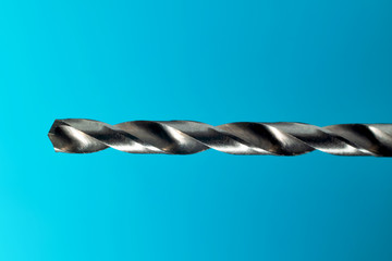 Drill Bit Close Up On Blue Background