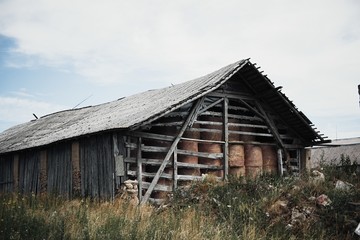 Dry hay stacks in rural wooden barn