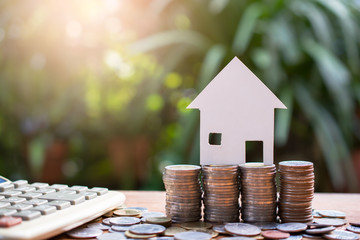 house model on money for concept investment mortgage finance and home loan refinance
