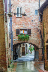 Back street in an old Italian town with a vault