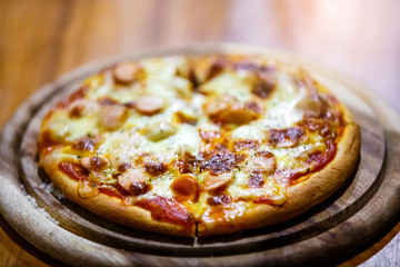 close up homemade pizza on wooden plate , DOF effect