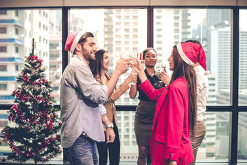Couple office workers celebrating with drink wine together in the company.
