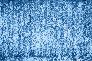 Dark rusty metal texture in classic blue trendy color. background. Color of the year 2020.