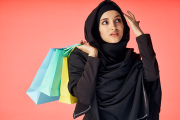 young woman with shopping bags