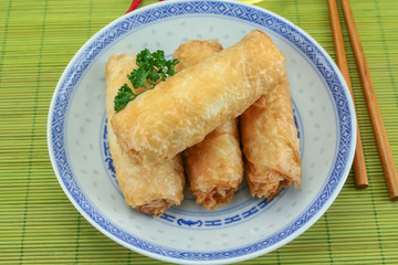 several spring rolls in a dish