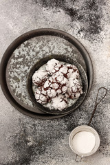 Chocolate cookies with cracks on a white background