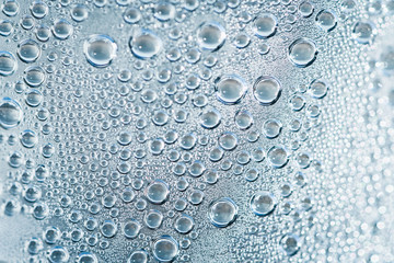 Closeup circle water drops droplets on the bottled water