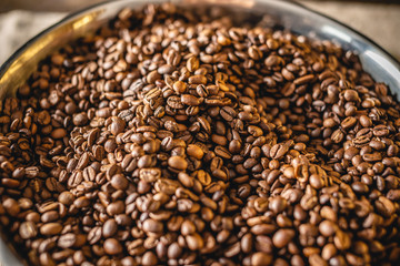 Pile of freshly roasted aromatic Arabica coffee beans. Coffee background with space for text