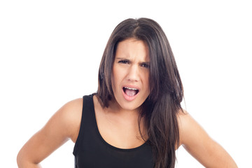 Fototapeta premium portrait of angry young brunette woman screaming