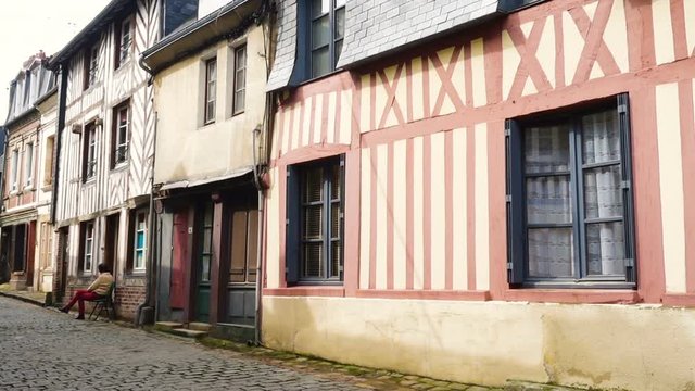 HONFLEUR, FRANCE - APRIL 08, 2018: view of empty beautiful street with old traditional houses at the center of Honfleur, Normandy, France