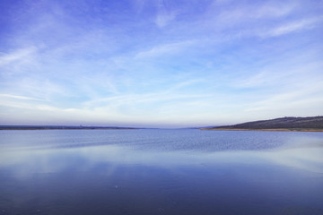 sunset sky blue and pink over a lake in Gagauzia