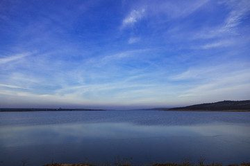 sunset sky blue and pink over a lake in Gagauzia