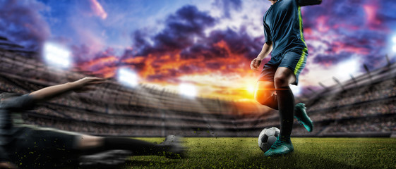 Soccer player kicks the ball on the soccer field.Professional soccer player in action. - obrazy, fototapety, plakaty