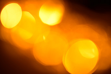 Bright yellow lights bokeh blur background.