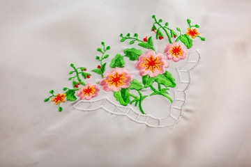 White tablecloth with embroidered flowers