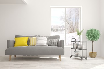 Stylish room in white color with sofa and winter landscape in window. Scandinavian interior design. 3D illustration