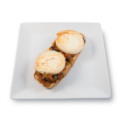 Goat cheese log slices in a ratatouille toast