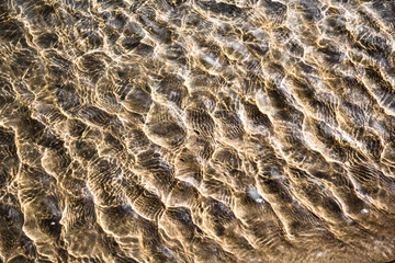 paradise of human dreams - crystal clear water waves on golden sand beach