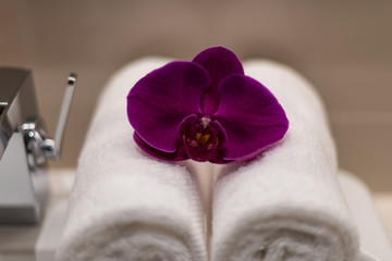 Obraz na płótnie Canvas Orchid flower on towel