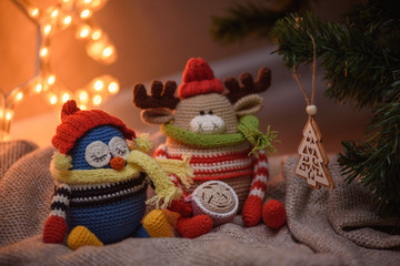 Amigurumi toy. Penguin and deer.