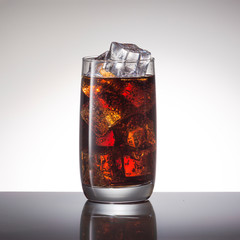 Cocktail with rum with cola and ice, close-up, copy space