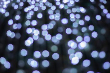 Fototapeta na wymiar Bokeh blur of lights for decorating Christmas trees at Christmas and New Year's every year. As a light background