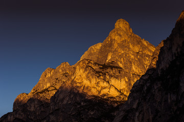 Beautiful sunset over the dolomitic peaks overlooking the Braies lake, South Tyrol, Italy