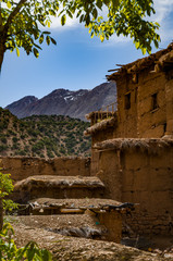 View of adobe houses in the high snow-capped mountains in the Aït Bouguemez valley in Morocco