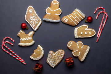 Christmas background. Handmade festive gingerbread cookies. Copy space for text. Winter holidays background mock up