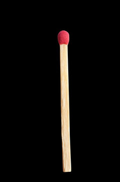 Wooden matchstick isolated on black background
