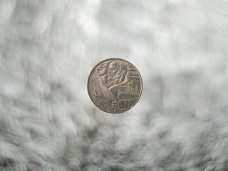 Anniversary soviet ruble against bokeh background