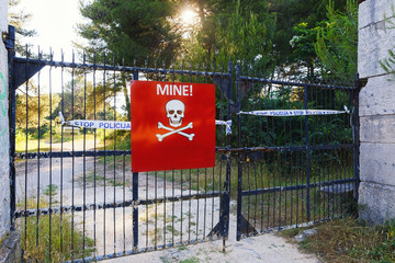Beware of mines sign on closed territory