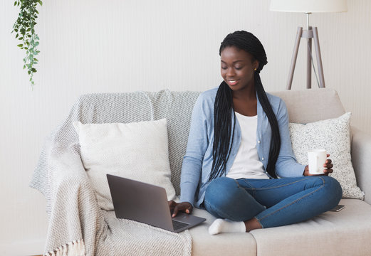 Black Millennial Girl Using Laptop At Home For Freelance Work