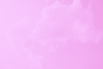 Pink sky background with soft delicate pink clouds. Copy space