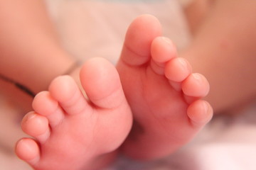 Closeup new born infant baby feet.