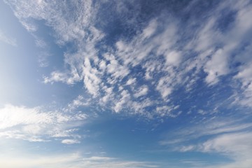 Fototapeta premium White clouds over blue sky as background texture