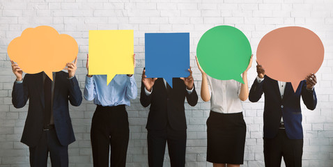 Group of corporate people hiding faces behind speech bubbles - obrazy, fototapety, plakaty
