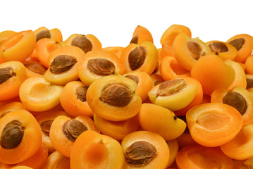 Ripe juicy orange apricots slices fruit background.